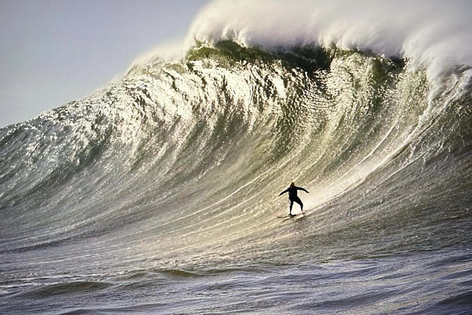 Edu dropping into a big wave on the Portuguese coast