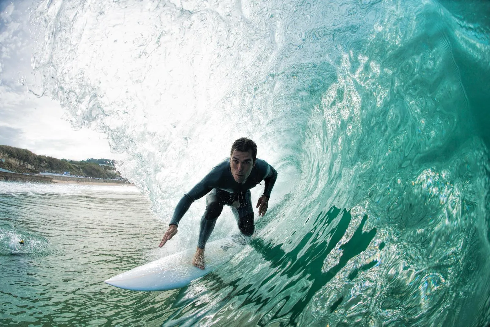 Edu deep inside a barrel on one of his own boards